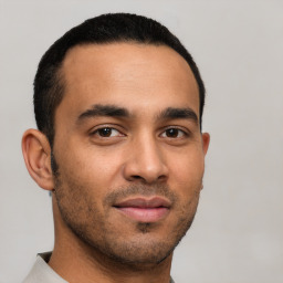 Neutral latino young-adult male with short  brown hair and brown eyes