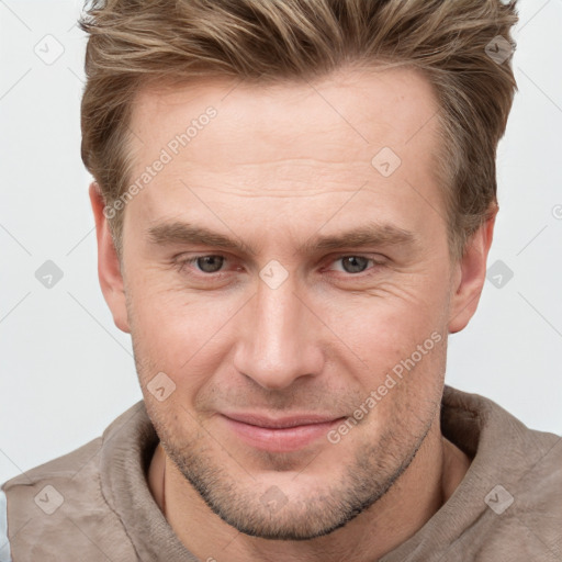 Joyful white adult male with short  brown hair and grey eyes