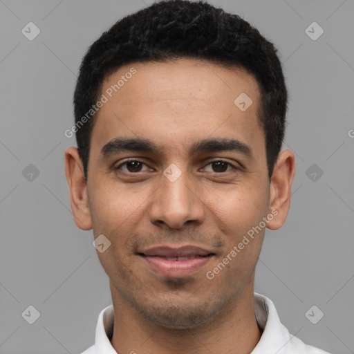 Joyful latino young-adult male with short  black hair and brown eyes