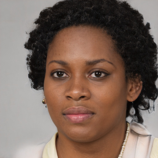 Neutral black young-adult female with long  black hair and brown eyes
