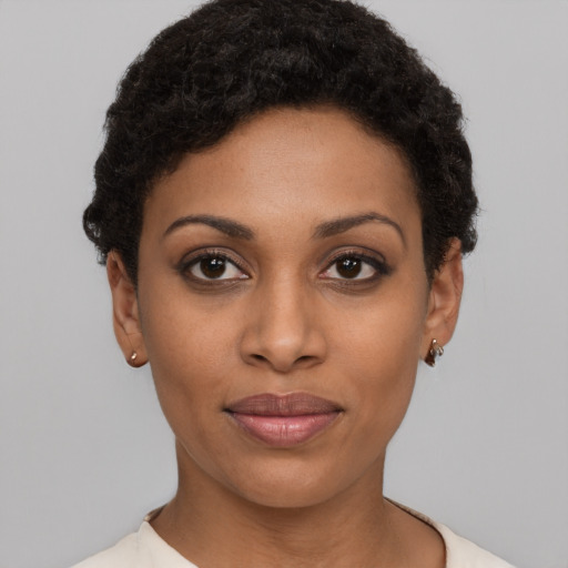 Joyful latino young-adult female with short  black hair and brown eyes