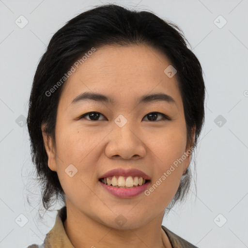 Joyful asian young-adult female with medium  brown hair and brown eyes