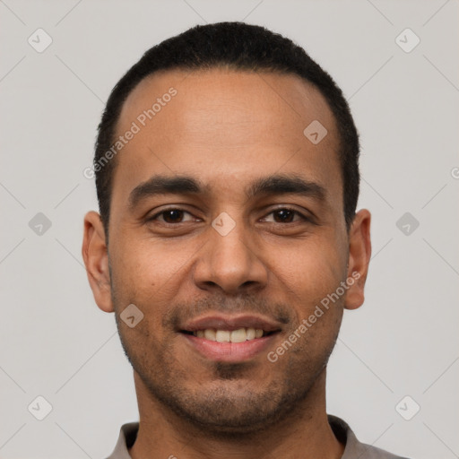 Joyful white young-adult male with short  black hair and brown eyes