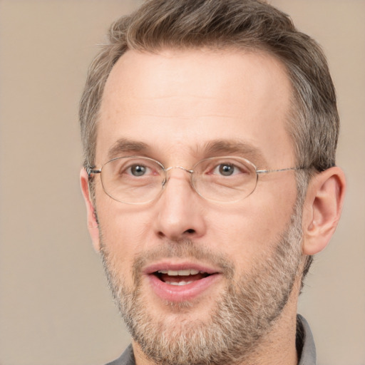 Joyful white adult male with short  brown hair and grey eyes