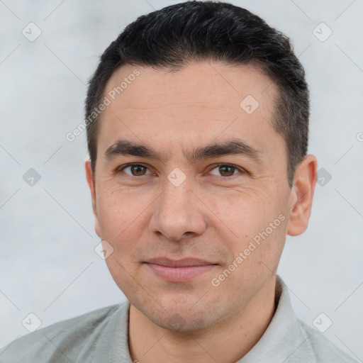 Joyful white young-adult male with short  black hair and brown eyes