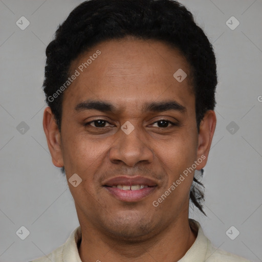 Joyful latino young-adult male with short  black hair and brown eyes
