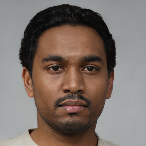 Neutral black young-adult male with short  black hair and brown eyes