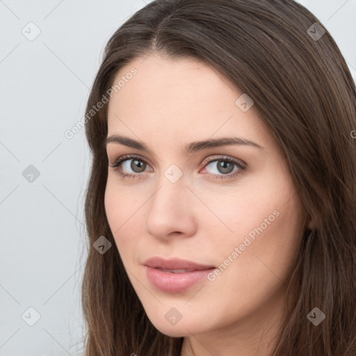 Neutral white young-adult female with long  brown hair and brown eyes