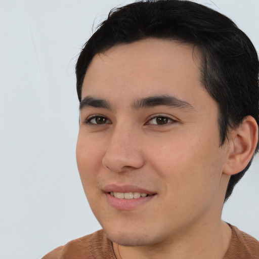 Joyful asian young-adult male with short  brown hair and brown eyes