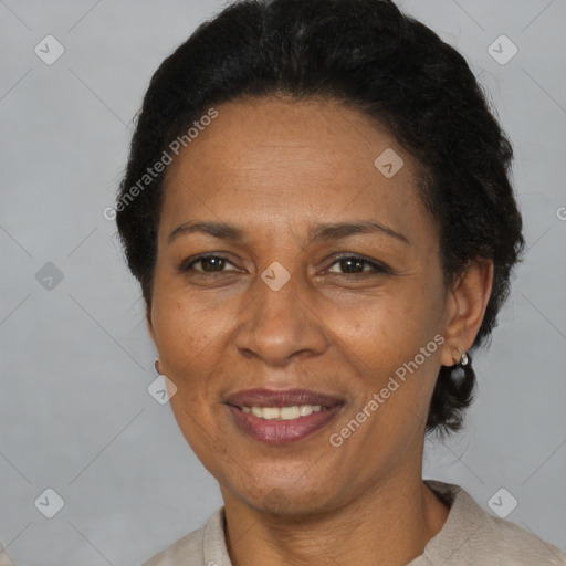 Joyful black adult female with short  brown hair and brown eyes