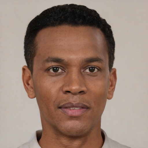 Neutral black young-adult male with short  black hair and brown eyes