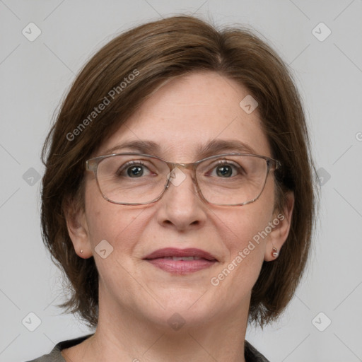 Joyful white adult female with medium  brown hair and grey eyes