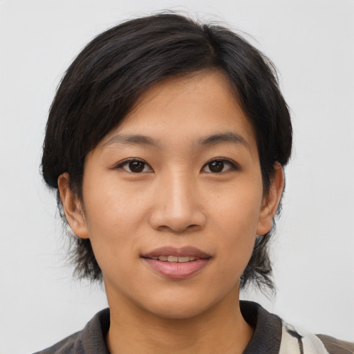 Joyful asian young-adult female with medium  black hair and brown eyes