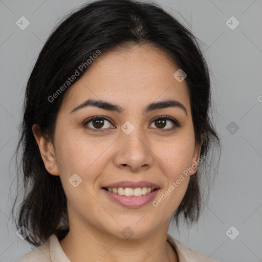 Joyful latino young-adult female with medium  brown hair and brown eyes