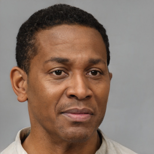 Neutral latino adult male with short  brown hair and brown eyes