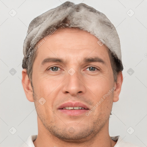 Joyful white adult male with short  brown hair and brown eyes