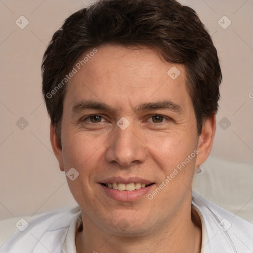 Joyful white adult male with short  brown hair and brown eyes