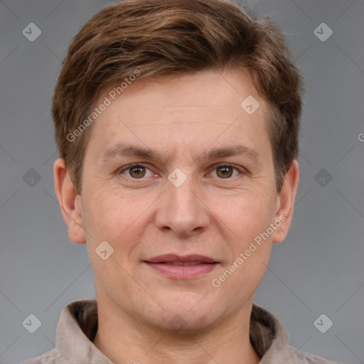 Joyful white adult male with short  brown hair and grey eyes