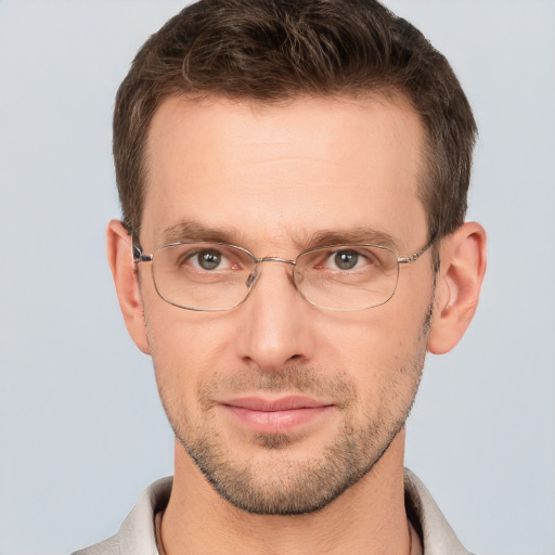 Joyful white adult male with short  brown hair and brown eyes