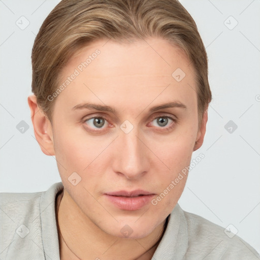 Joyful white young-adult female with short  brown hair and blue eyes