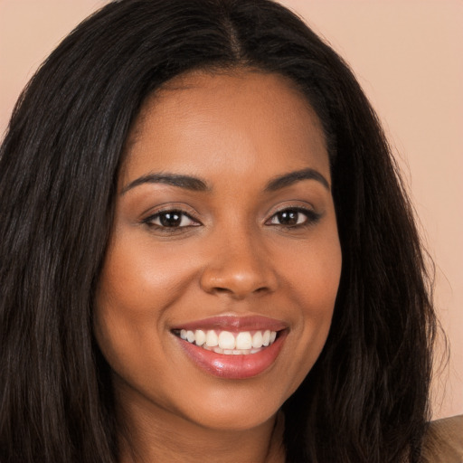 Joyful latino young-adult female with long  brown hair and brown eyes