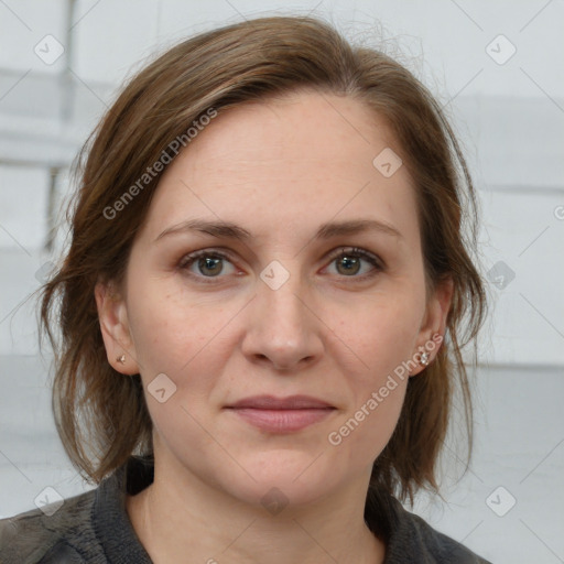 Joyful white adult female with medium  brown hair and grey eyes