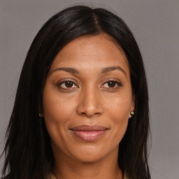 Joyful asian young-adult female with long  brown hair and brown eyes