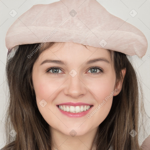 Joyful white young-adult female with long  brown hair and grey eyes