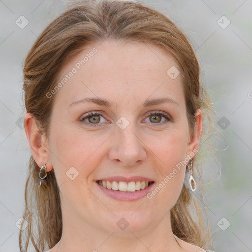 Joyful white young-adult female with medium  brown hair and blue eyes