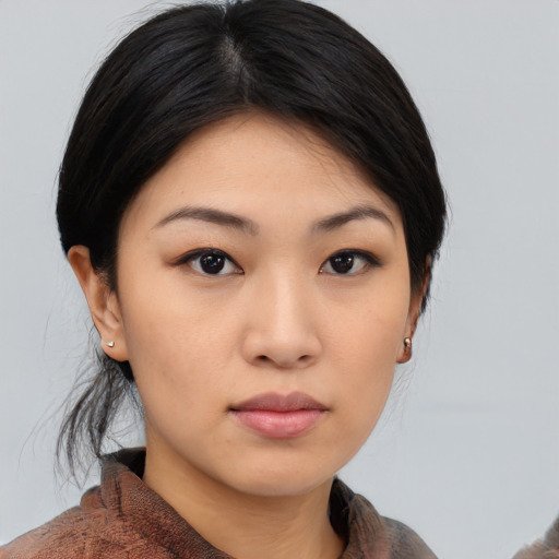 Neutral asian young-adult female with medium  brown hair and brown eyes