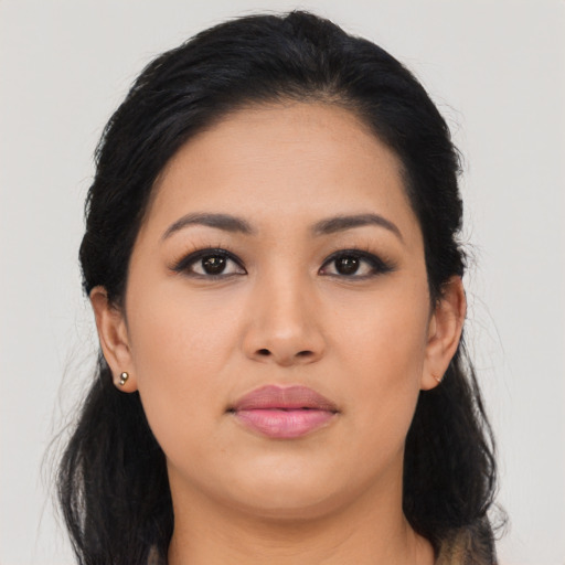 Joyful asian young-adult female with long  black hair and brown eyes