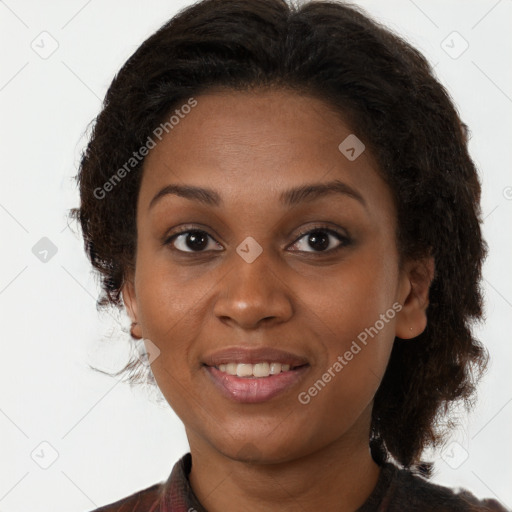 Joyful black young-adult female with medium  brown hair and brown eyes