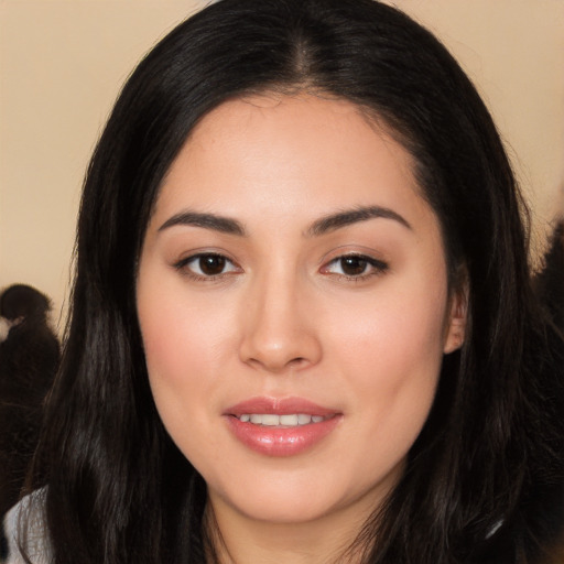 Joyful white young-adult female with long  black hair and brown eyes