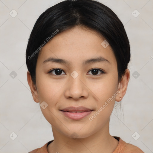 Joyful latino young-adult female with short  black hair and brown eyes