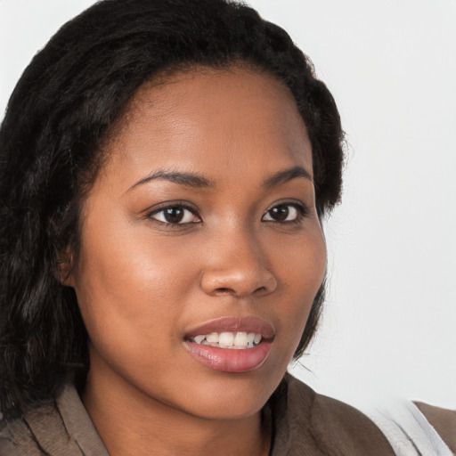 Joyful latino young-adult female with long  brown hair and brown eyes