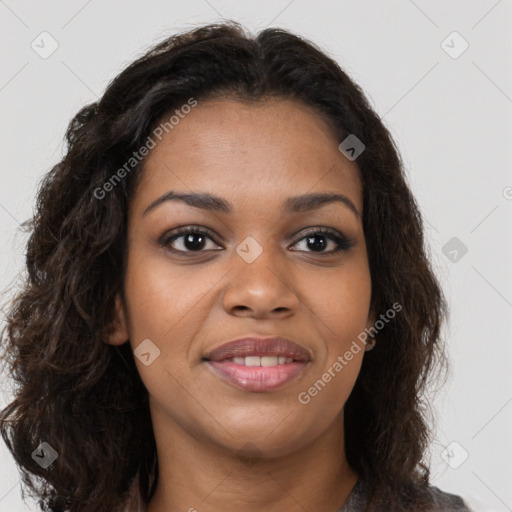 Joyful black young-adult female with long  brown hair and brown eyes