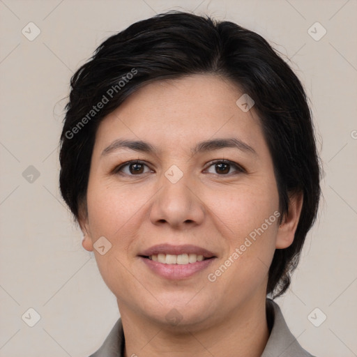 Joyful white adult female with short  brown hair and brown eyes