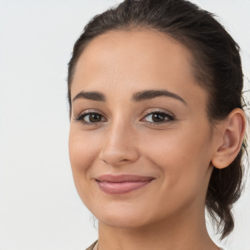 Joyful white young-adult female with medium  brown hair and brown eyes