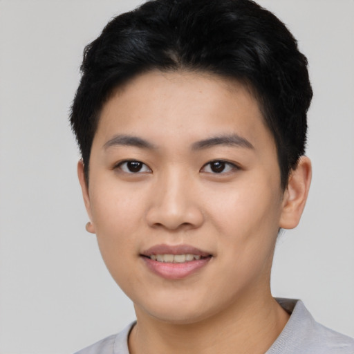 Joyful asian young-adult female with short  black hair and brown eyes