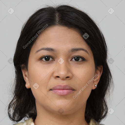 Joyful latino young-adult female with medium  brown hair and brown eyes