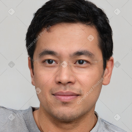 Joyful asian young-adult male with short  black hair and brown eyes