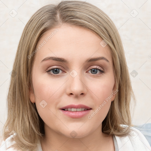 Joyful white young-adult female with medium  brown hair and green eyes