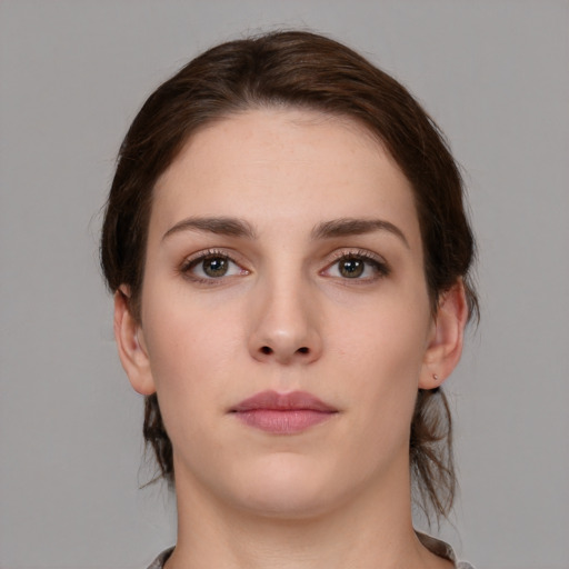 Neutral white young-adult female with medium  brown hair and brown eyes