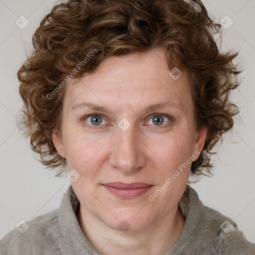 Joyful white adult female with medium  brown hair and blue eyes