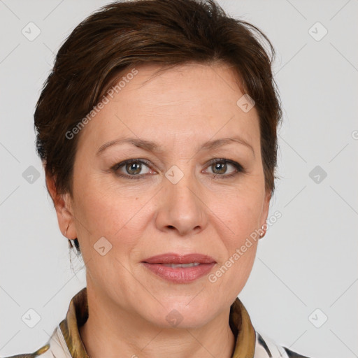 Joyful white adult female with medium  brown hair and grey eyes