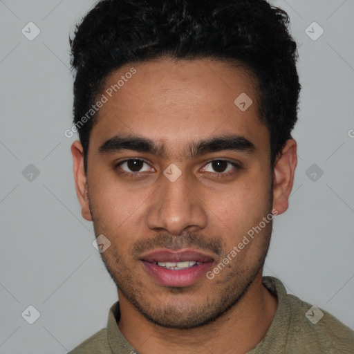 Joyful latino young-adult male with short  black hair and brown eyes