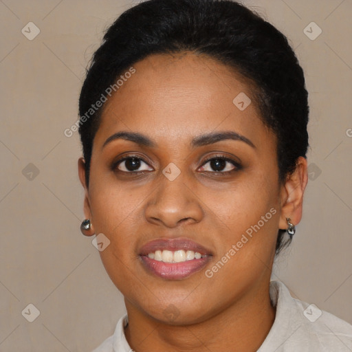 Joyful black young-adult female with short  black hair and brown eyes