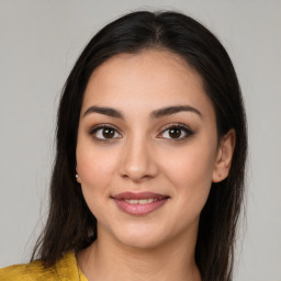 Joyful white young-adult female with medium  brown hair and brown eyes