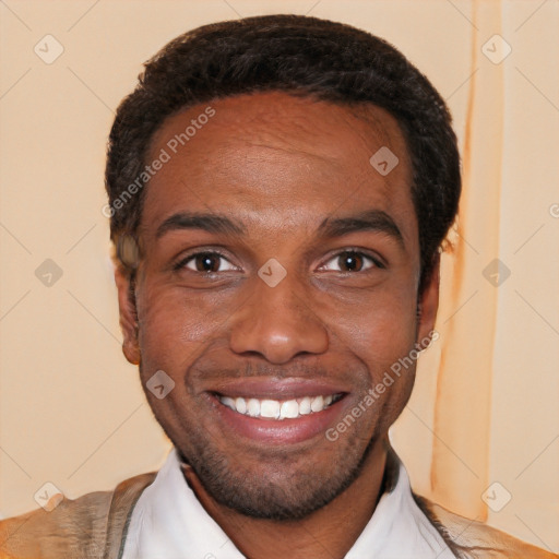 Joyful black young-adult male with short  black hair and brown eyes