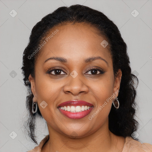 Joyful black young-adult female with long  brown hair and brown eyes